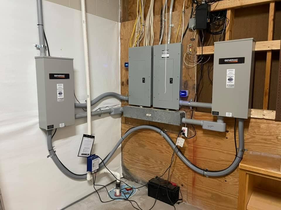 A room with electrical boxes and wires hanging from the wall.