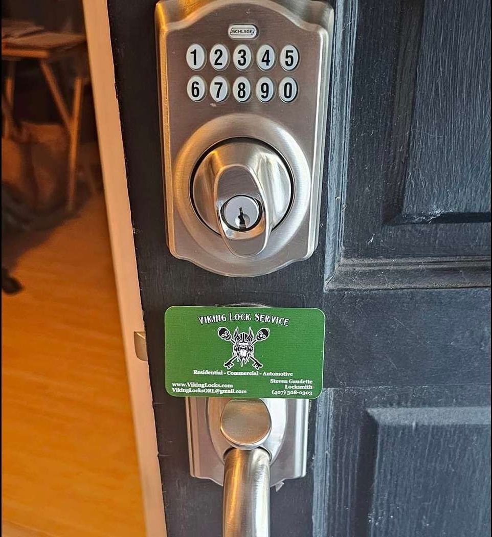 Handyman fixing or repairing apartment wooden door lock
