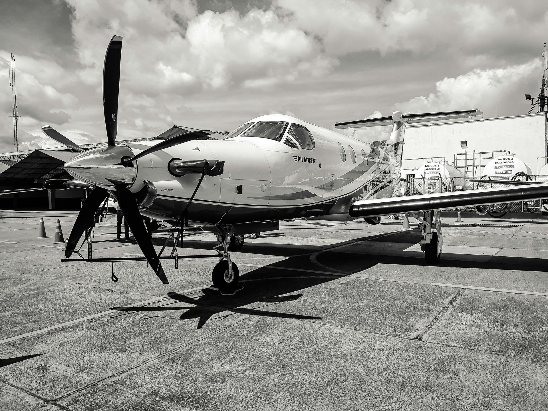 A black and white photo of the cockpit of an airplane