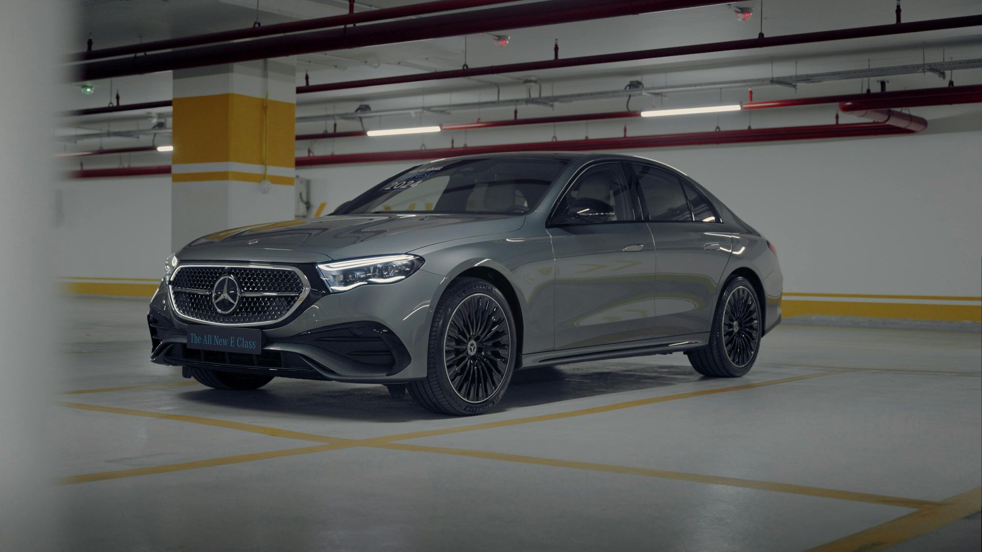 Gray Mercedes sedan parked in an empty underground garage