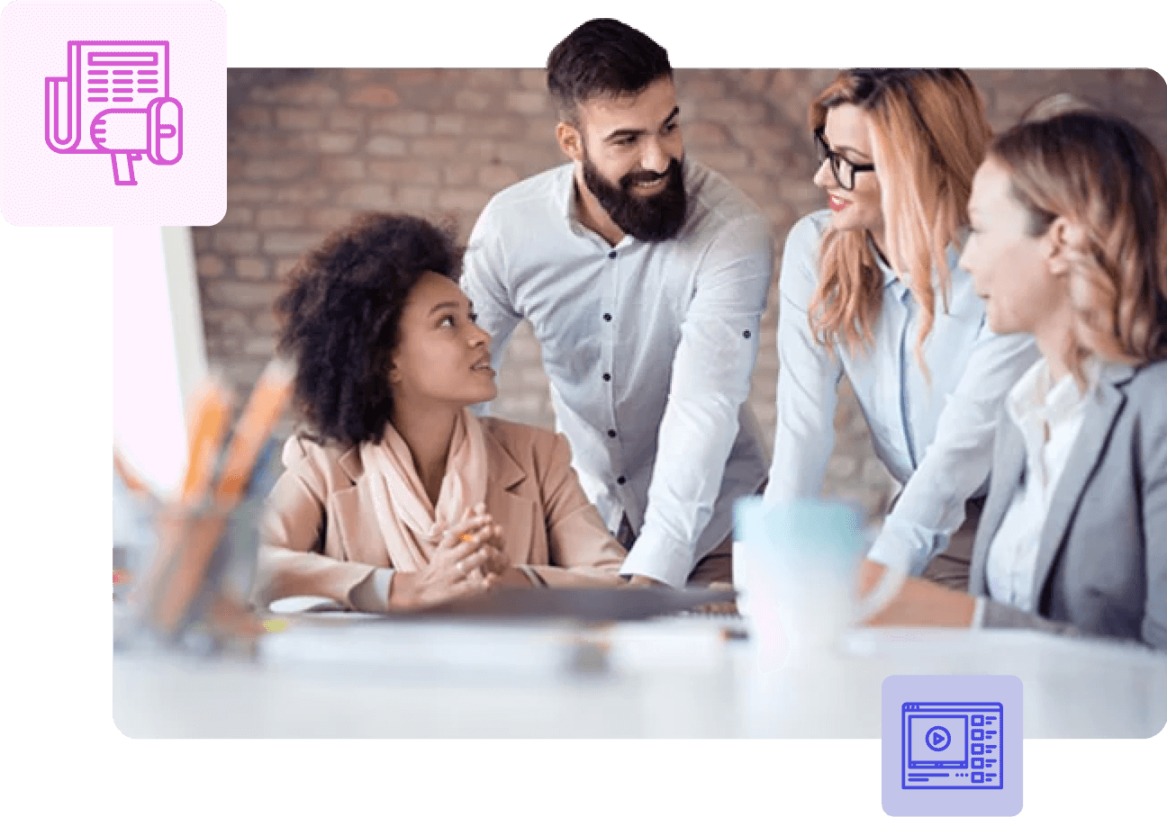 Colleagues in a bright office discussing a project around a table