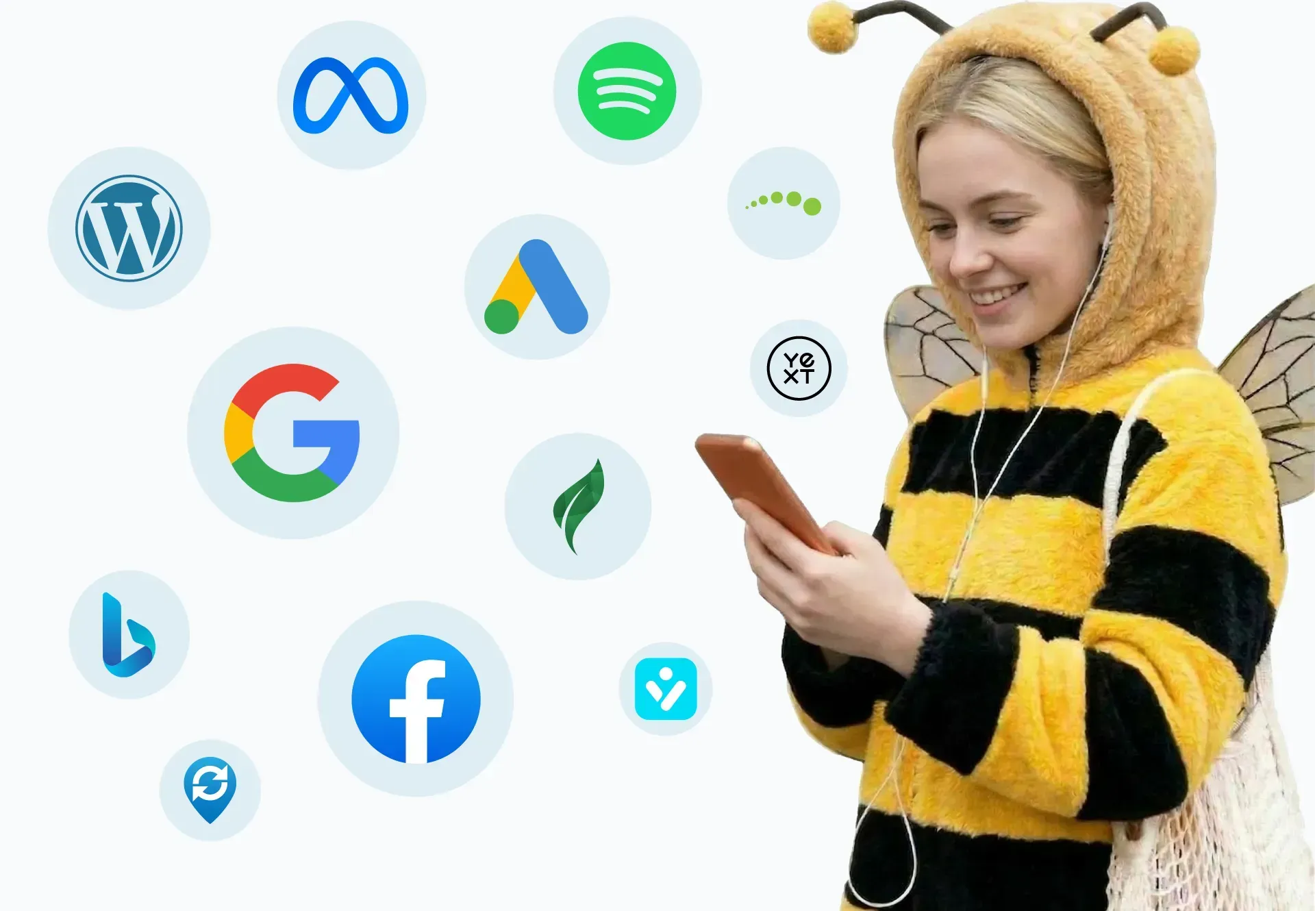 Person in a bee costume using a smartphone beside floating social media app icons