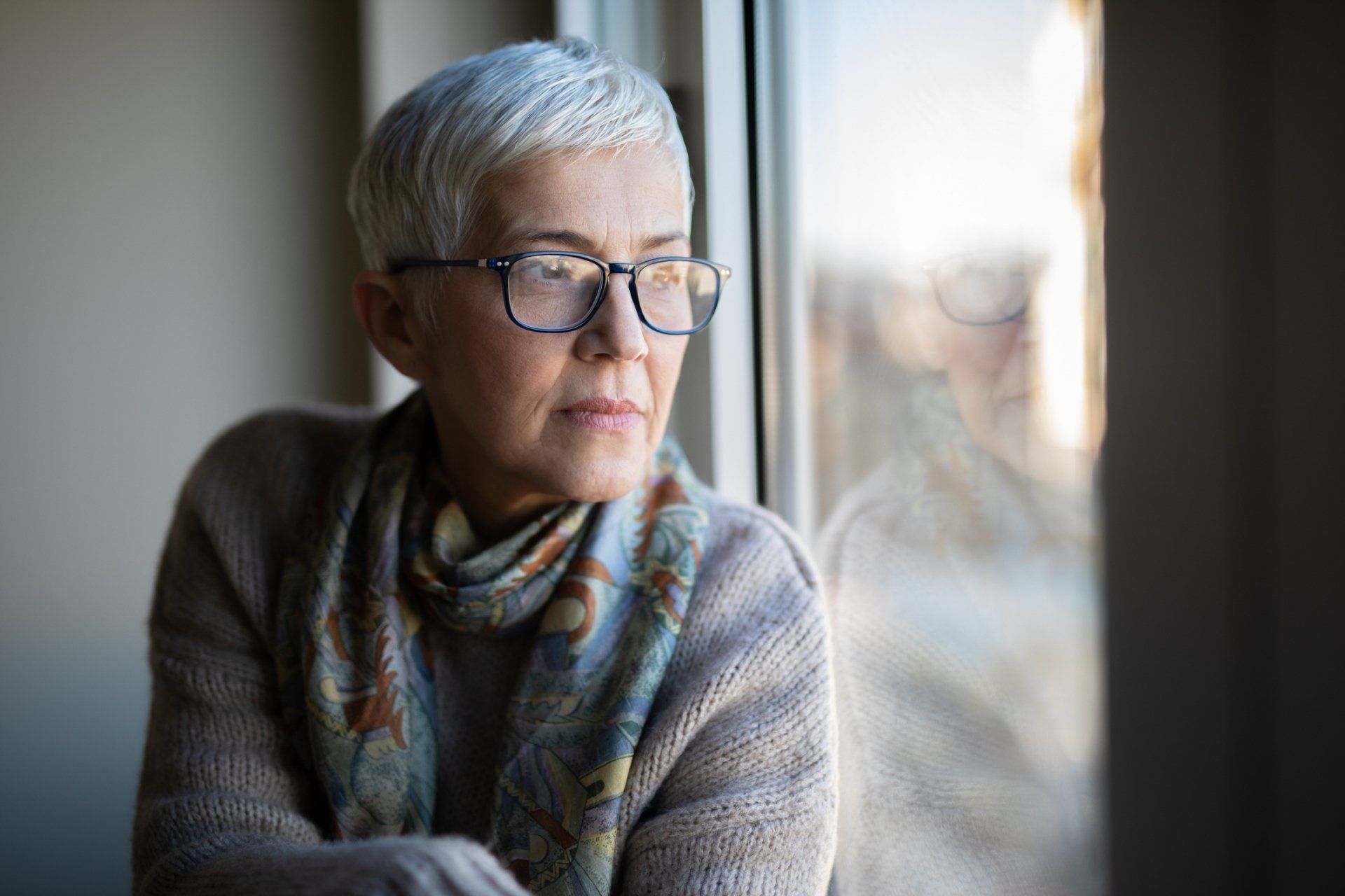 Woman Looking Out of the Window — Seguin, TX — Guadalupe Valley Family Violence Shelter, Inc. Woman Looking Out of the Window — Seguin, TX — Guadalupe Valley Family Violence Shelter, Inc.