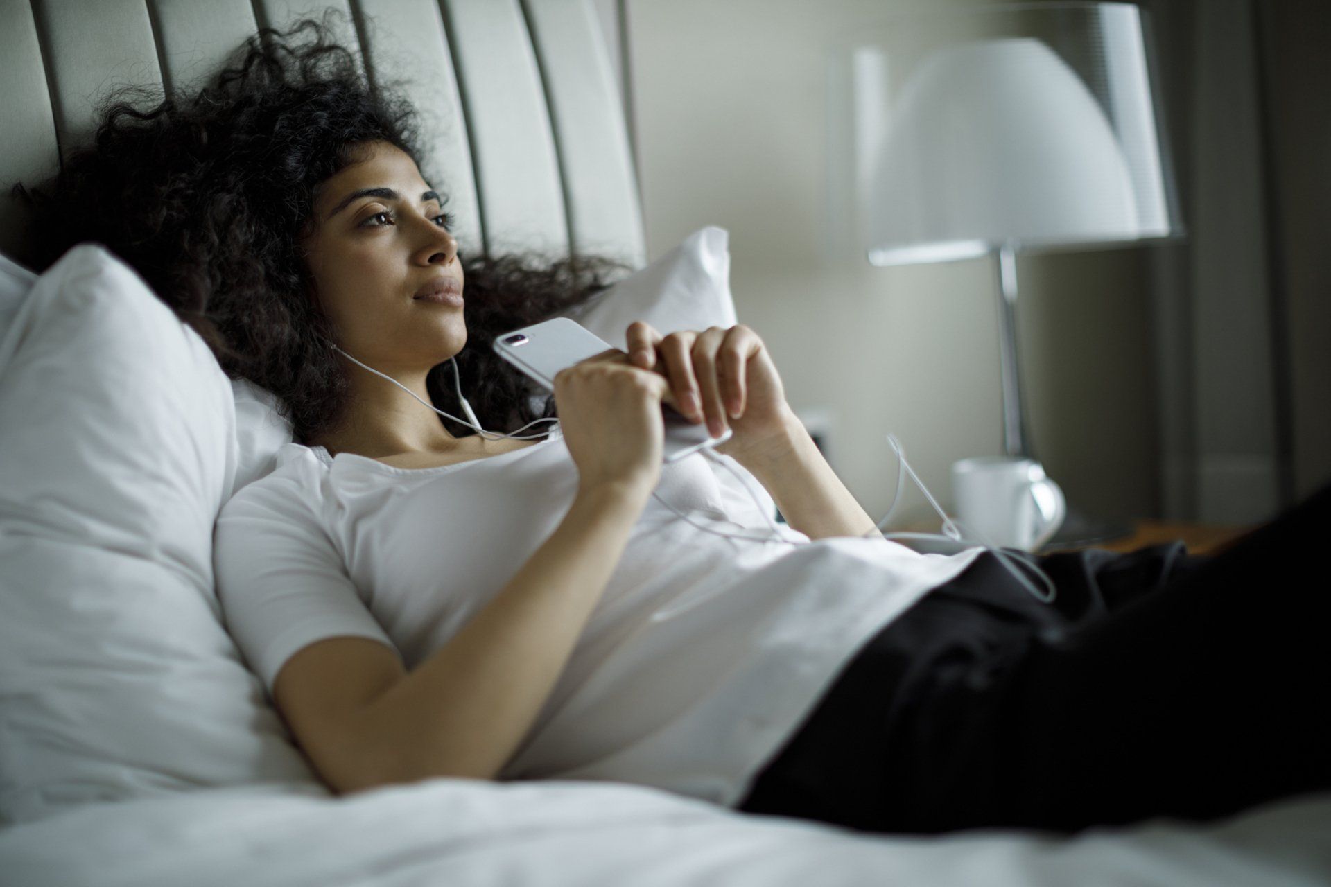 Woman with Her Phone — Seguin, TX — Guadalupe Valley Family Violence Shelter, Inc.