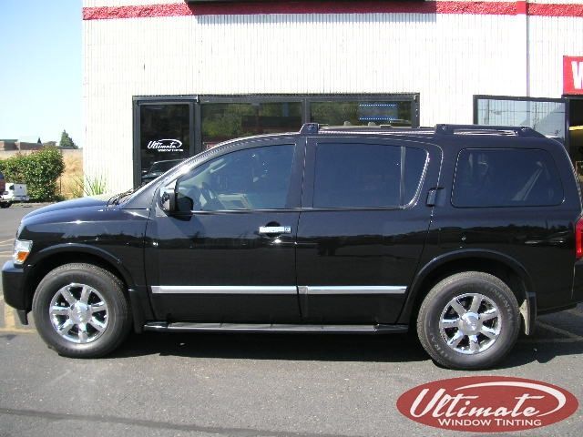 Black SUV parked outside a building with red trim