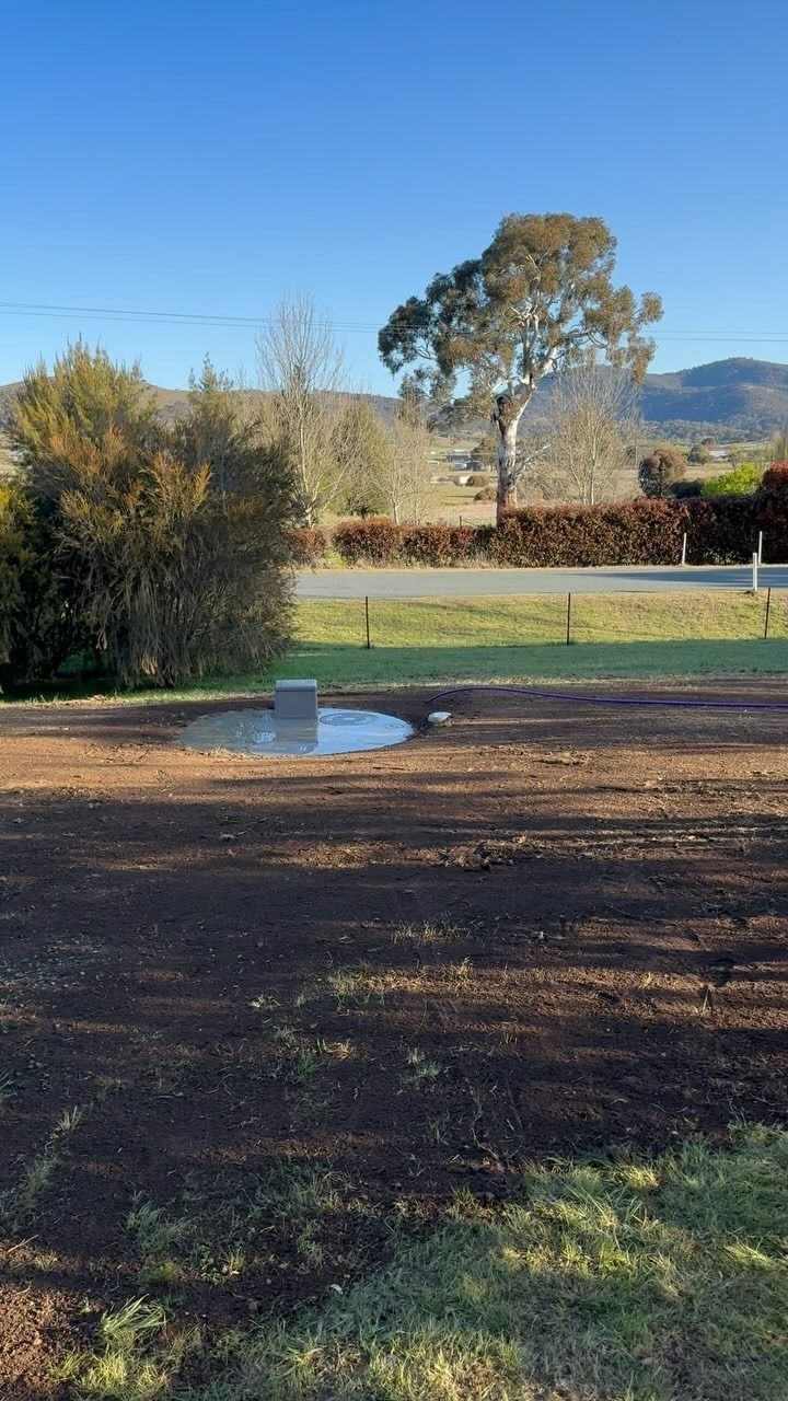 Brown Field With a Puddle — Demetrius Projects in Queanbeyan East, NSW