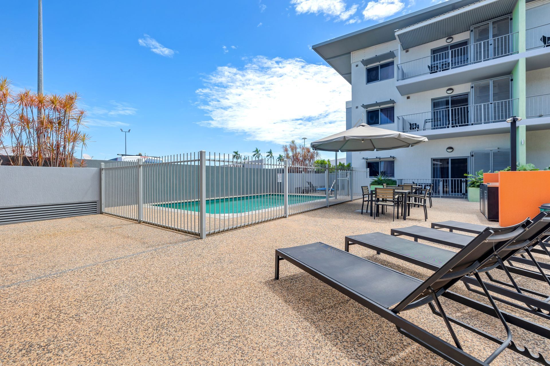 swimming pool and sun chairs