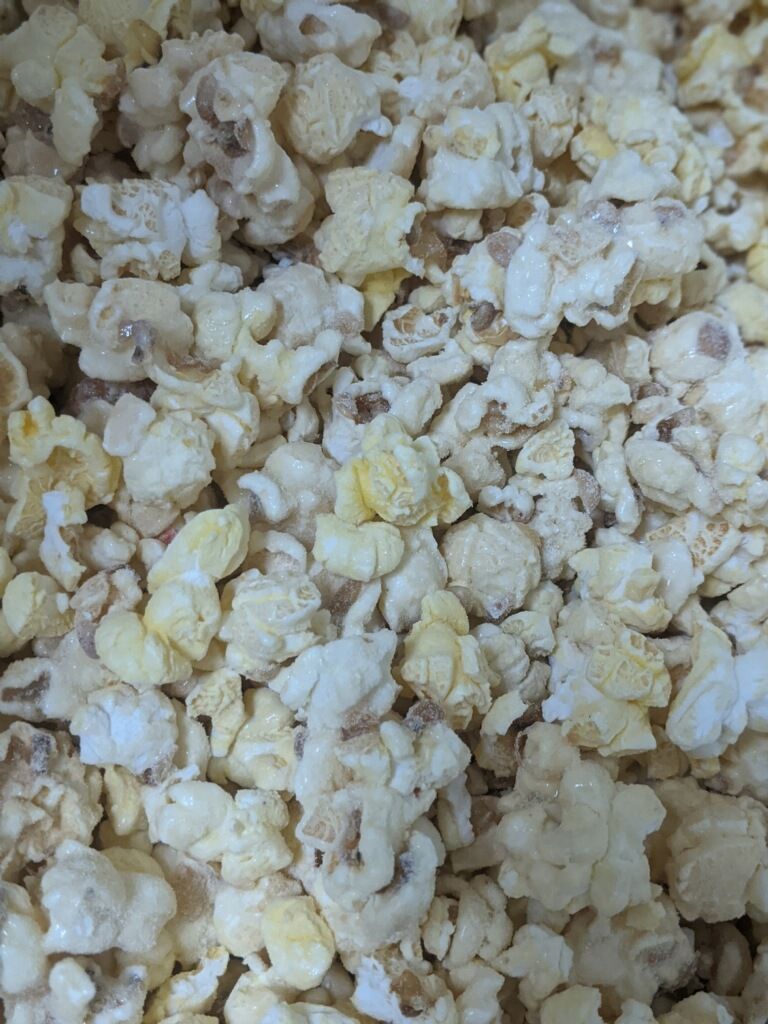 A close up of a pile of popcorn on a table.