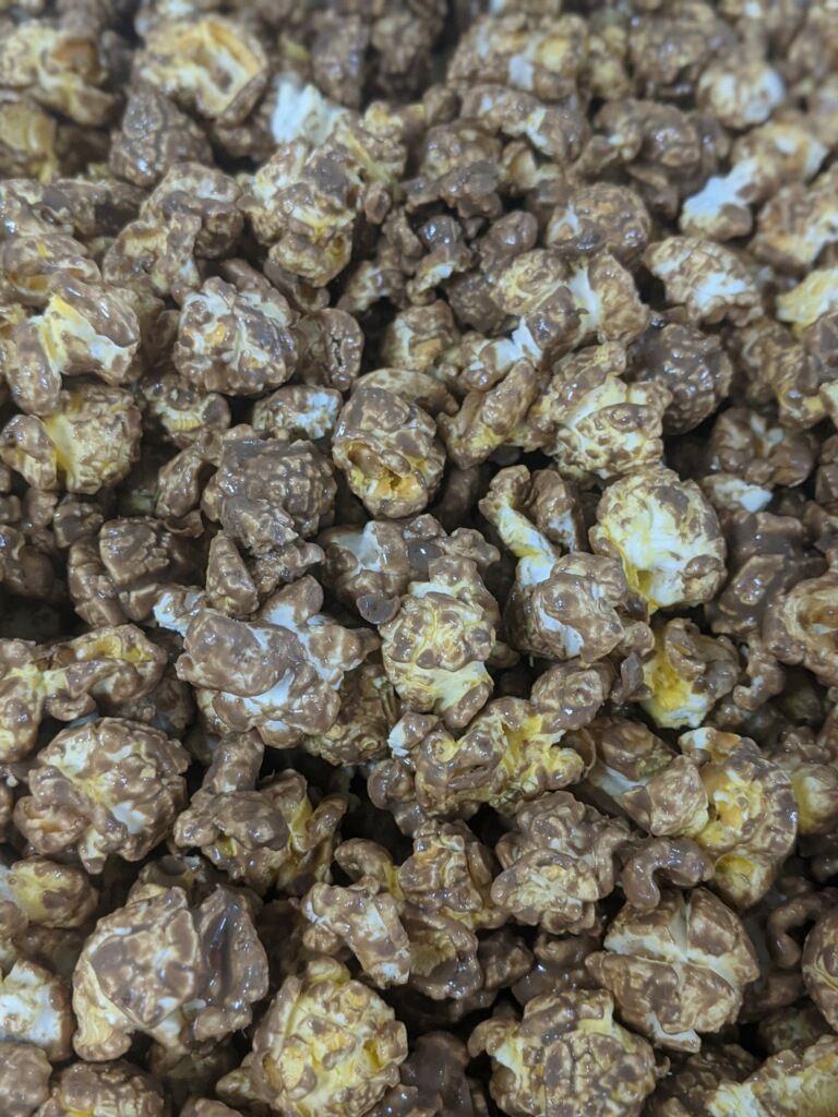 A close up of a pile of chocolate covered popcorn.