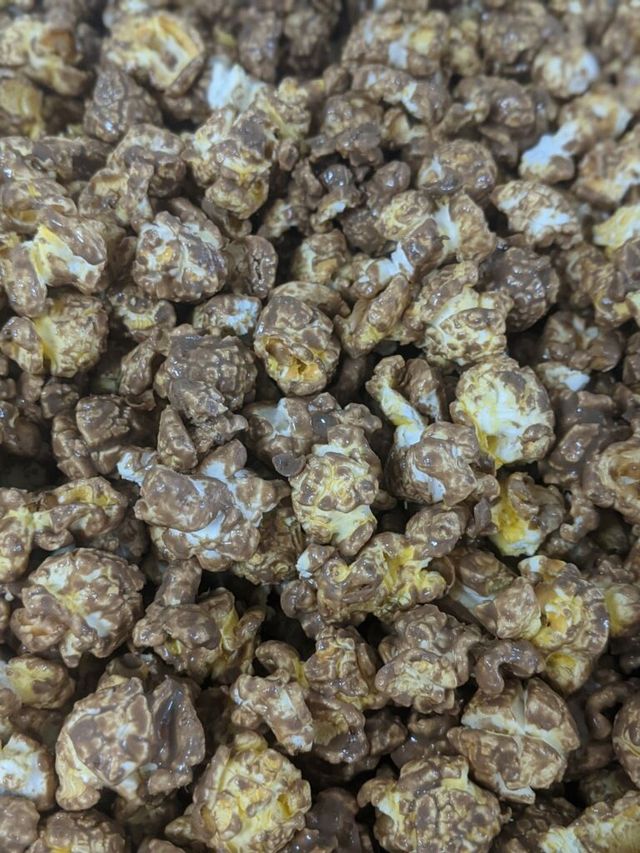 A close up of a pile of chocolate covered popcorn.