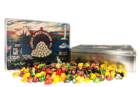A tin of popcorn featuring iconic Port Clinton, OH landmarks and a sample of gourmet popcorn available at Great Lakes Popcorn Co.