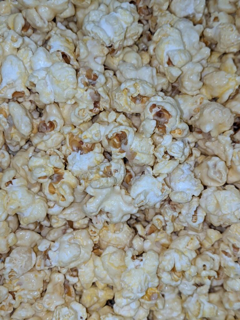 A close up of a pile of popcorn on a table.