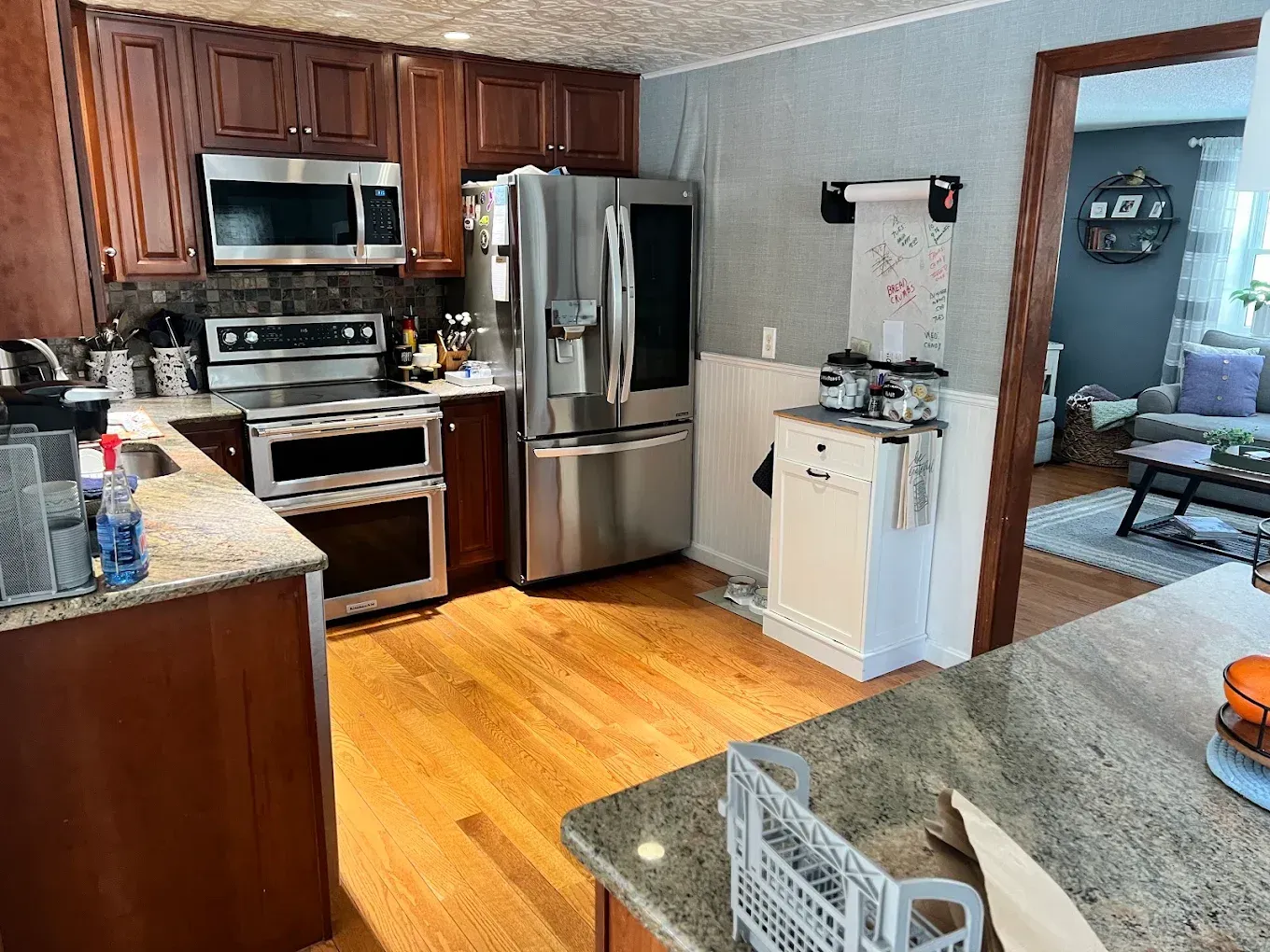 Kitchen with stainless steel appliances, wood cabinets, granite counters, 