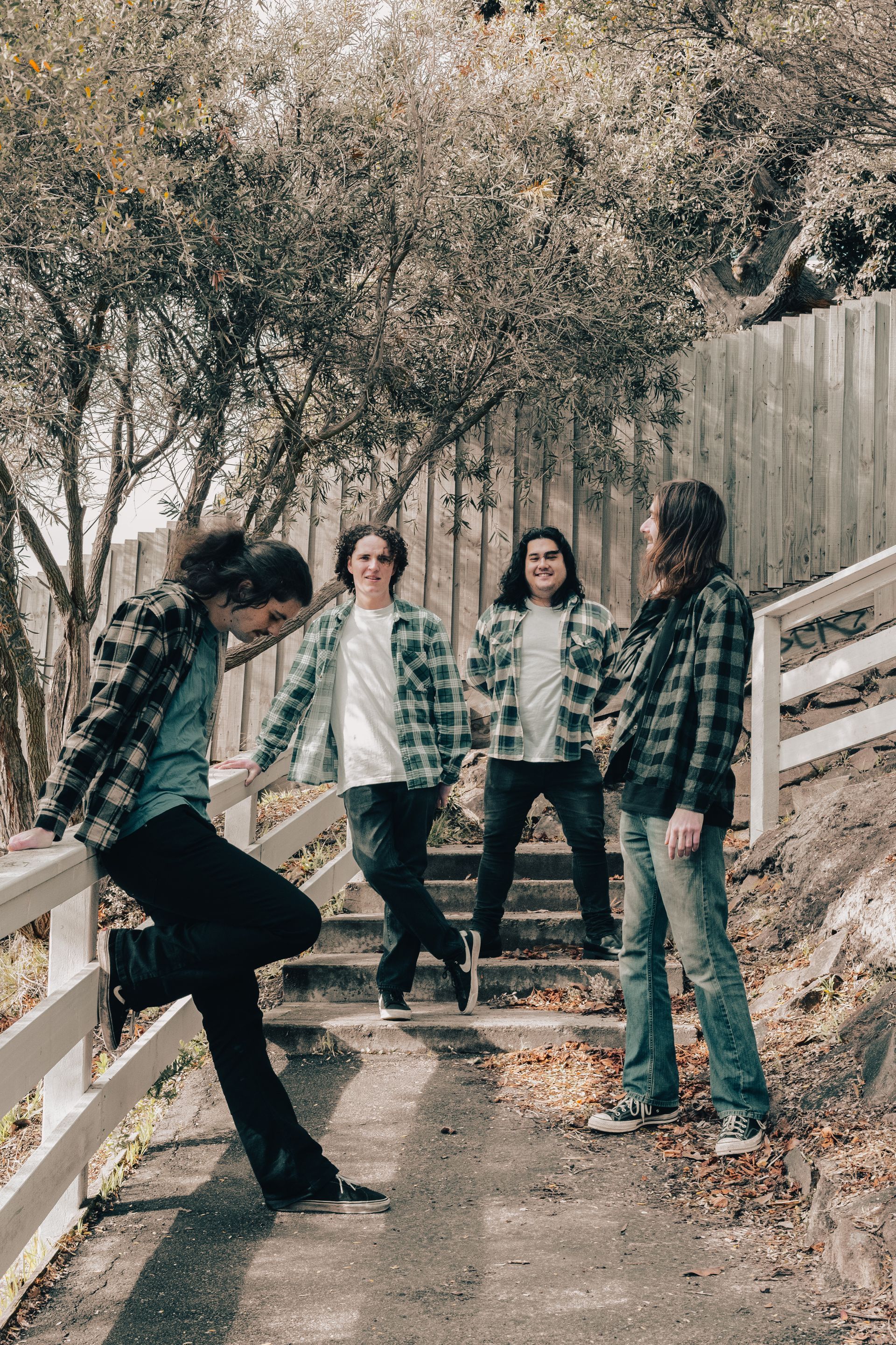 A group of people are posing for a picture on a set of stairs.