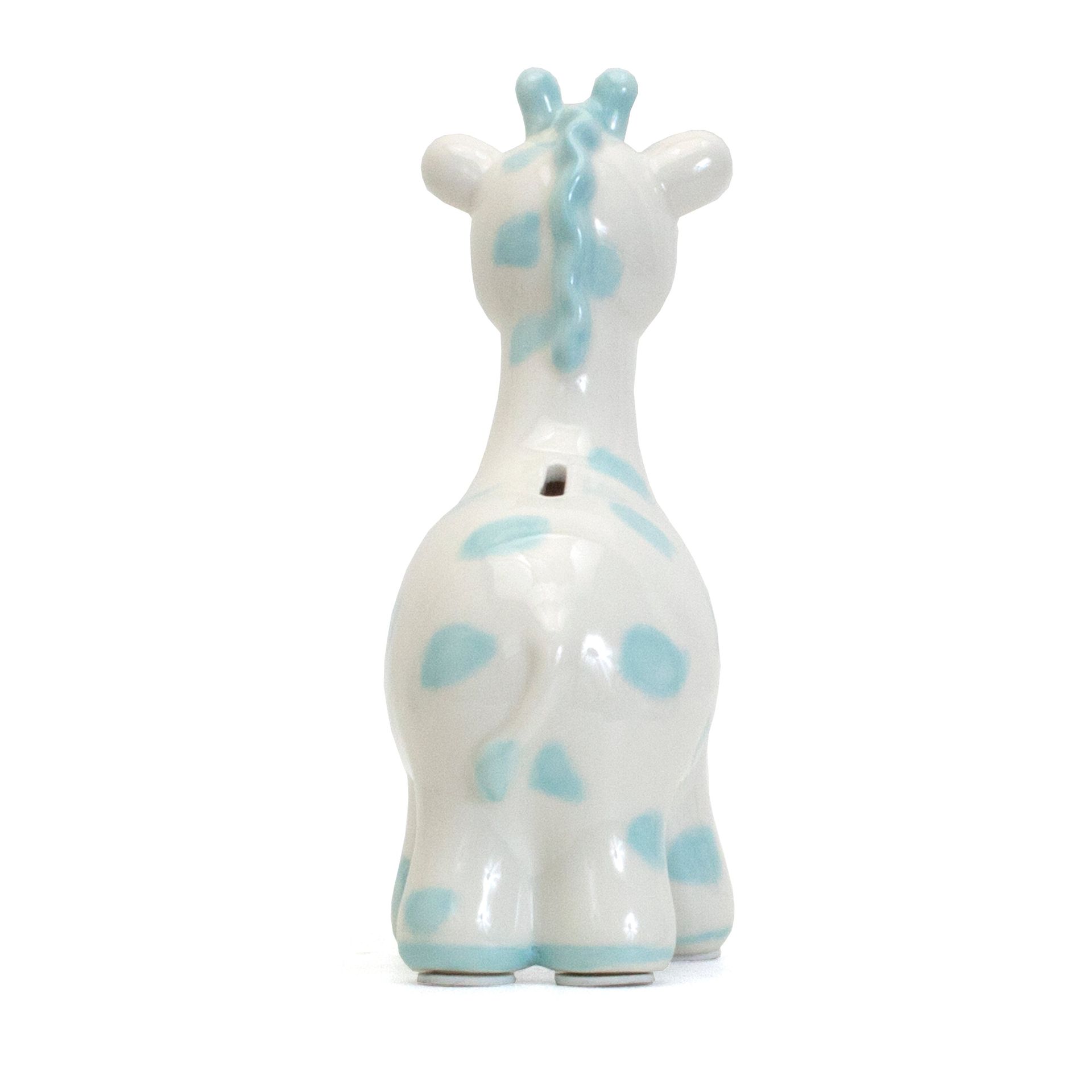 Small white giraffe figurine with light blue spots and mane, viewed from the back