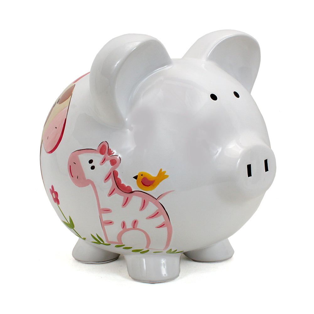 White piggy bank with pink pig and yellow bird design on a white background