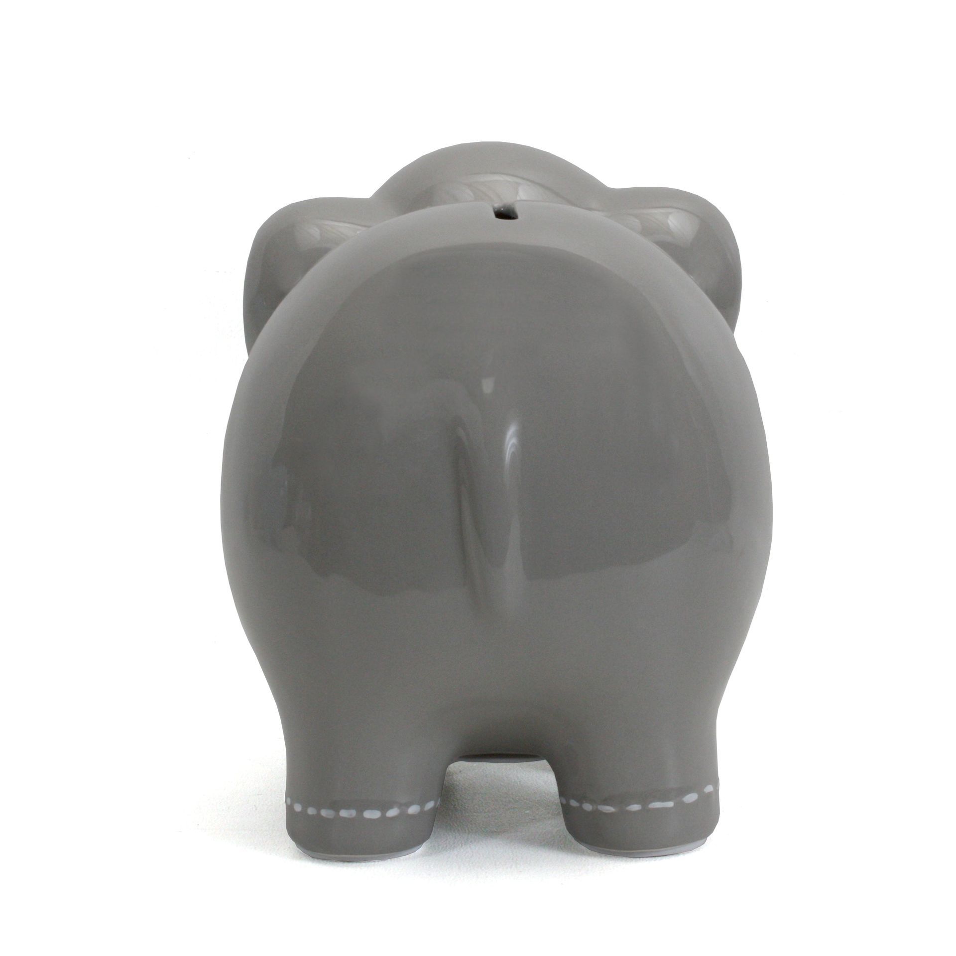 Gray ceramic piggy bank viewed from the back on a white background