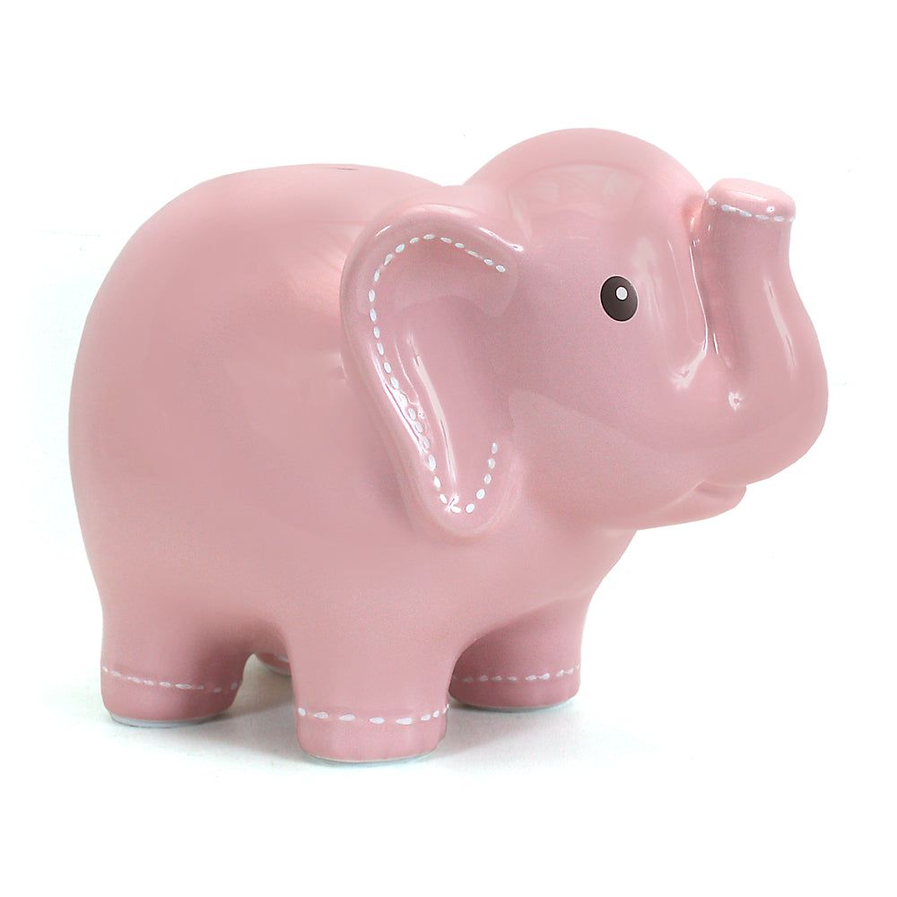 Pink ceramic elephant figurine with raised trunk on a white background