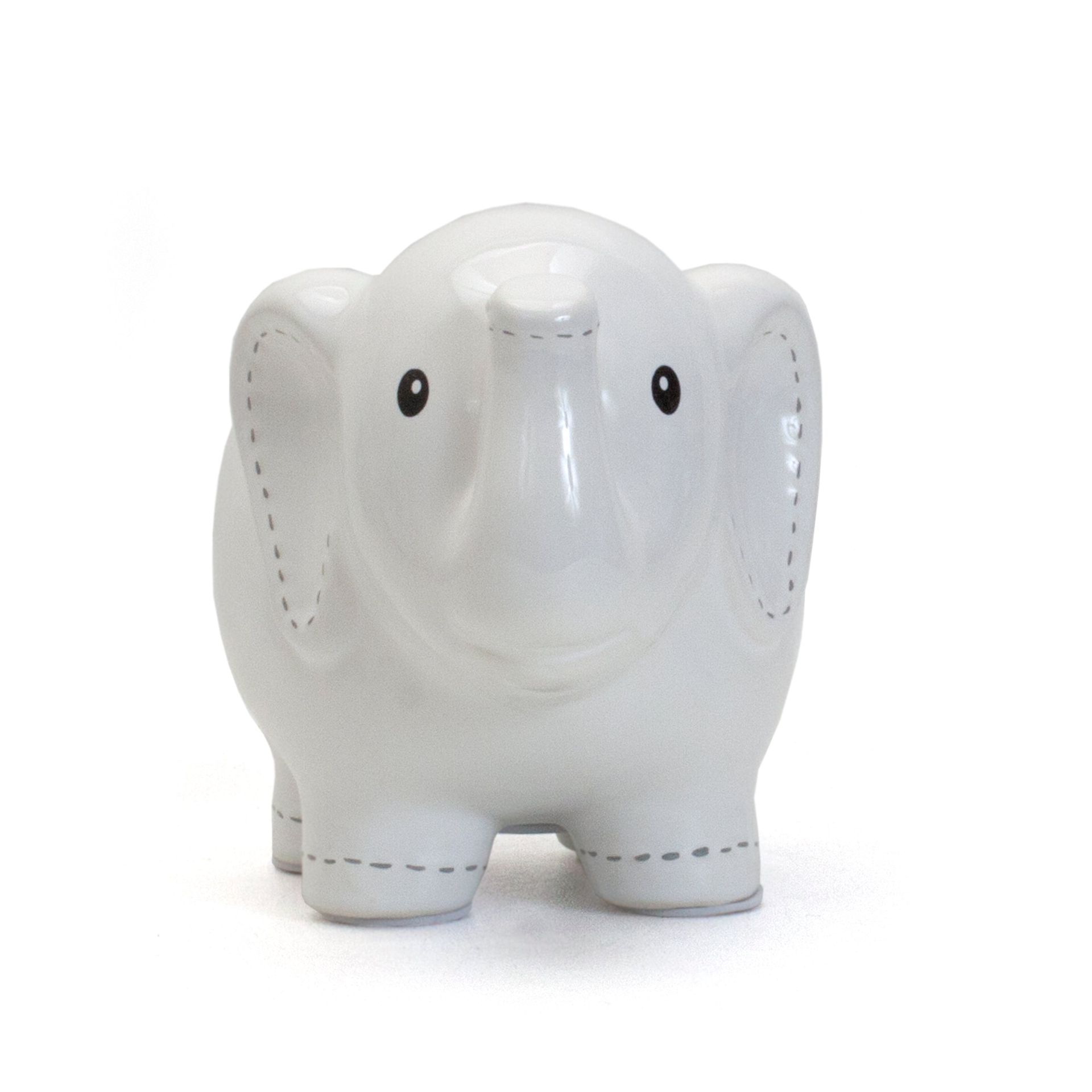 White ceramic elephant figurine with a glossy finish and black dot eyes