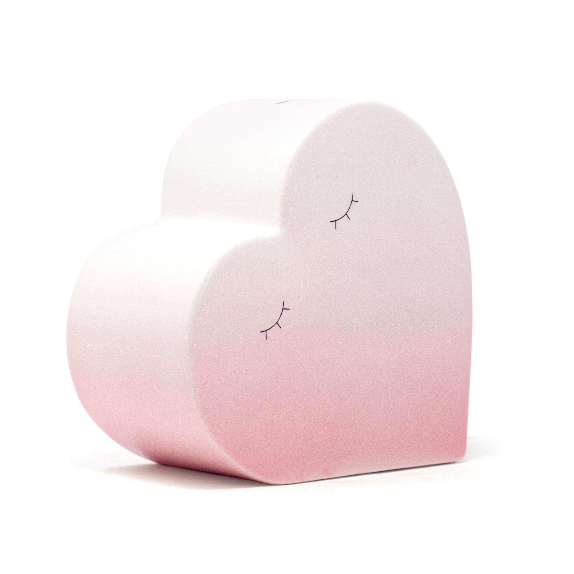Pink heart-shaped armchair with subtle crack details on a white background