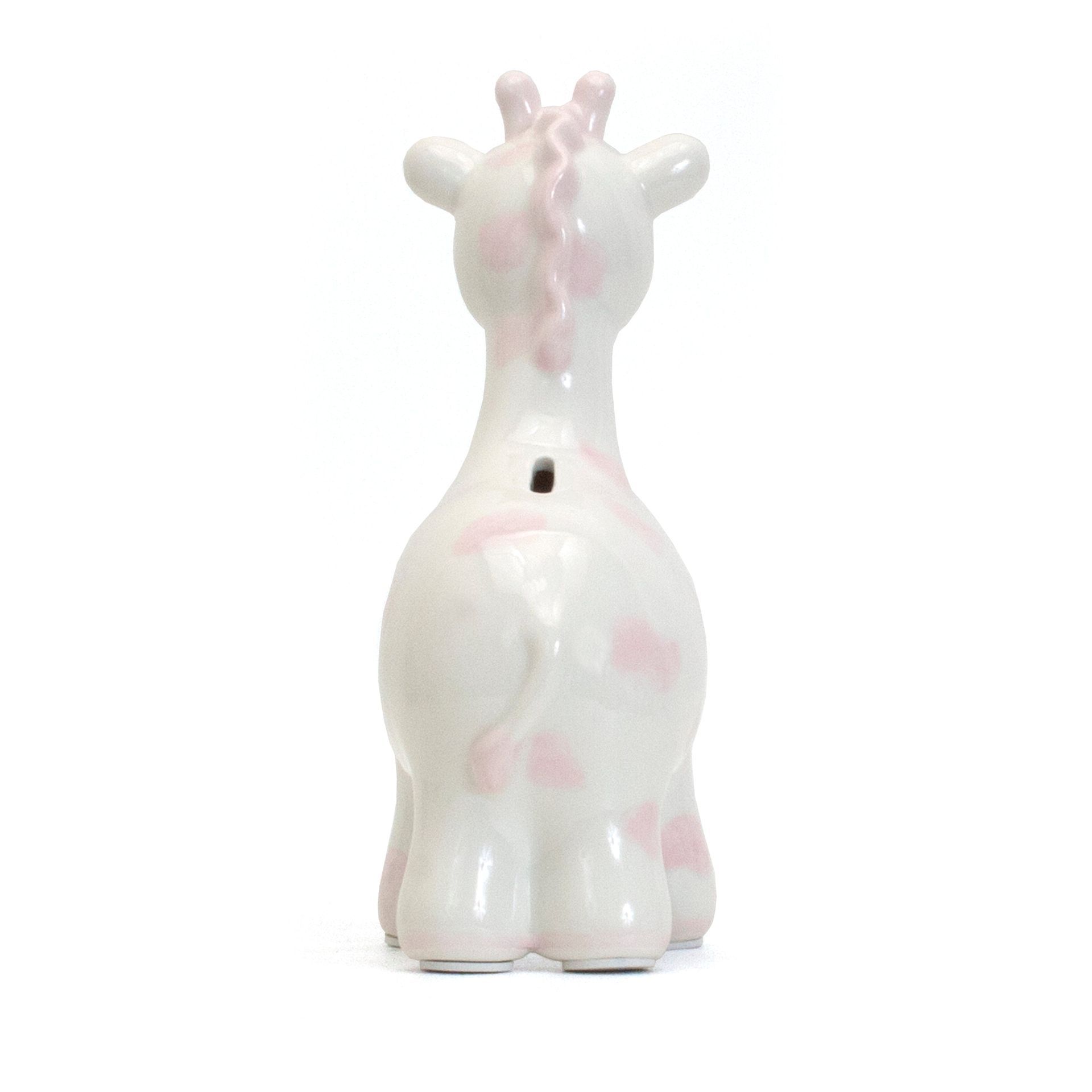 Small glossy white ceramic giraffe figurine with pale pink accents, shown from the back on a white background