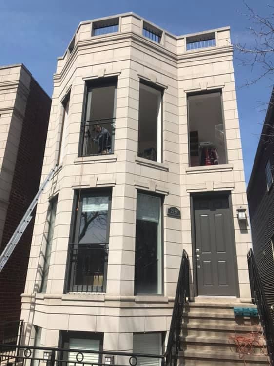 A building with a ladder on the side of it