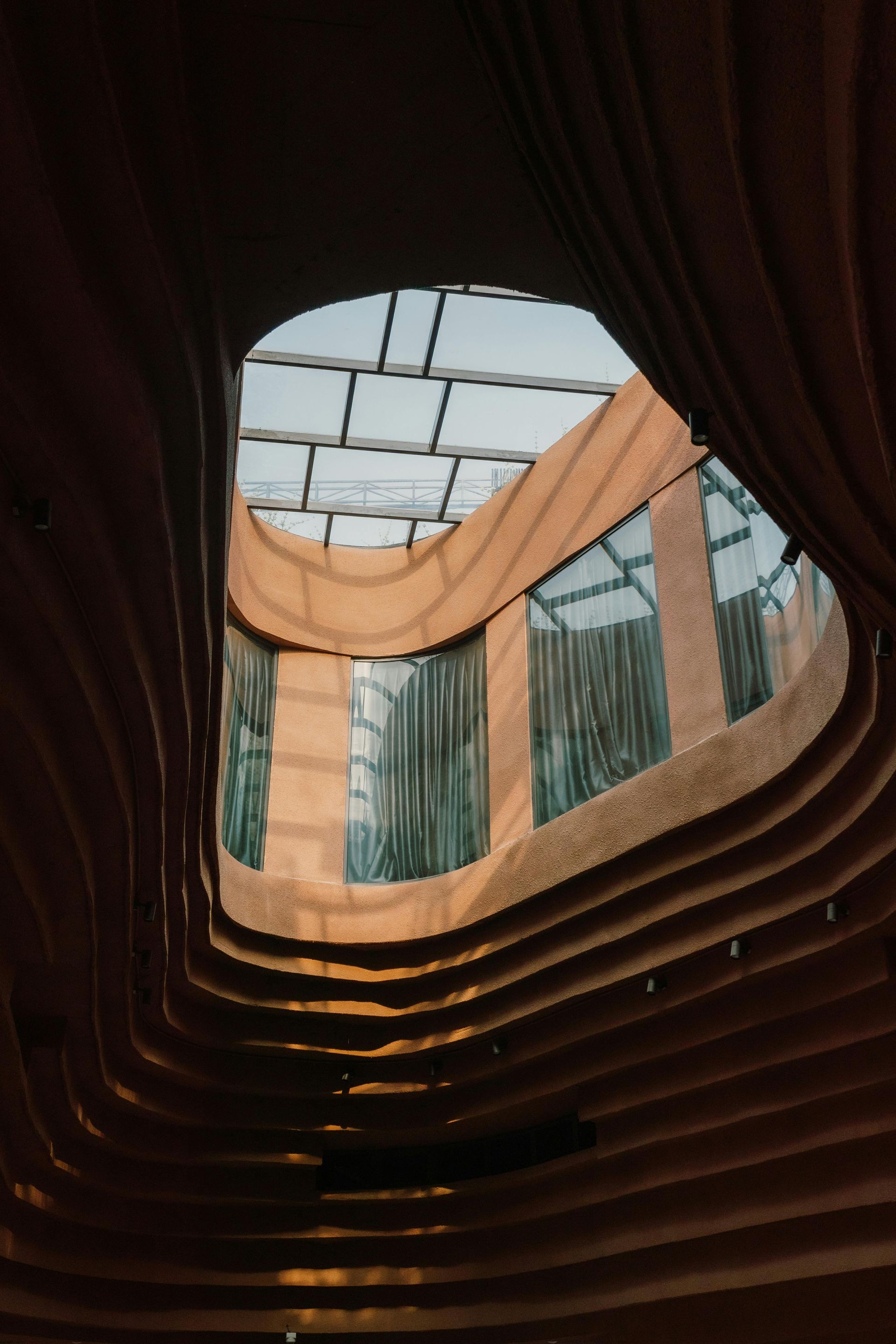 Looking up through a hole in the ceiling of a building