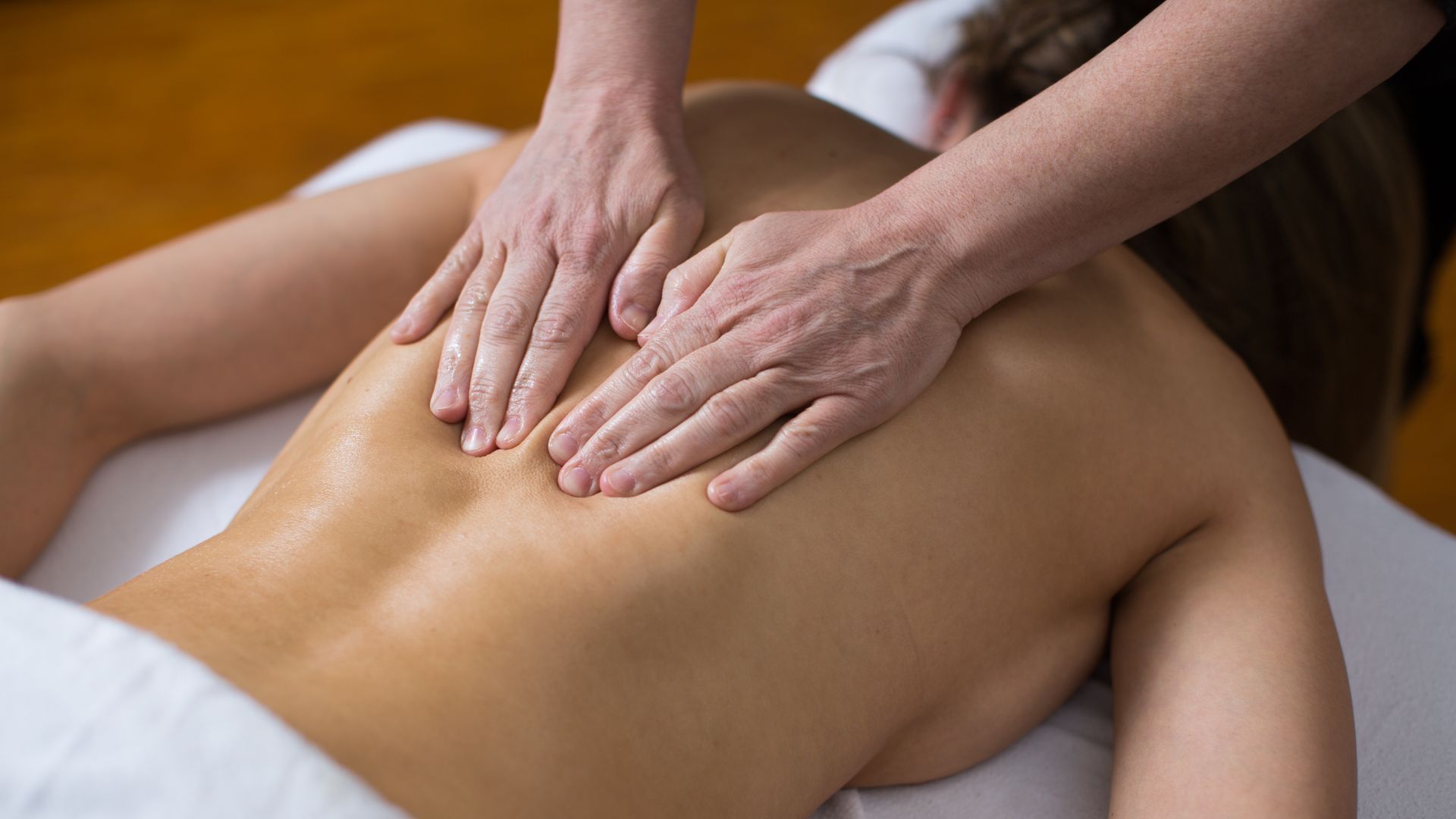 a woman is getting a massage on her back