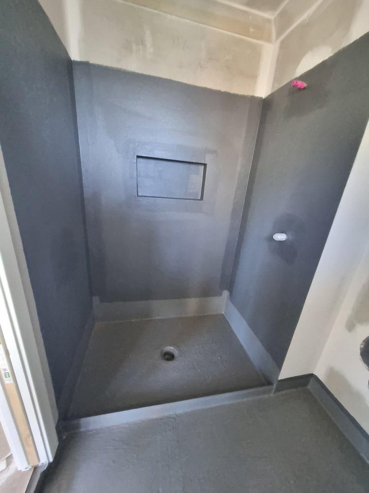 A Bathroom With a Shower Stall and a Window — Legend Waterproofing In Nords Wharf, NSW