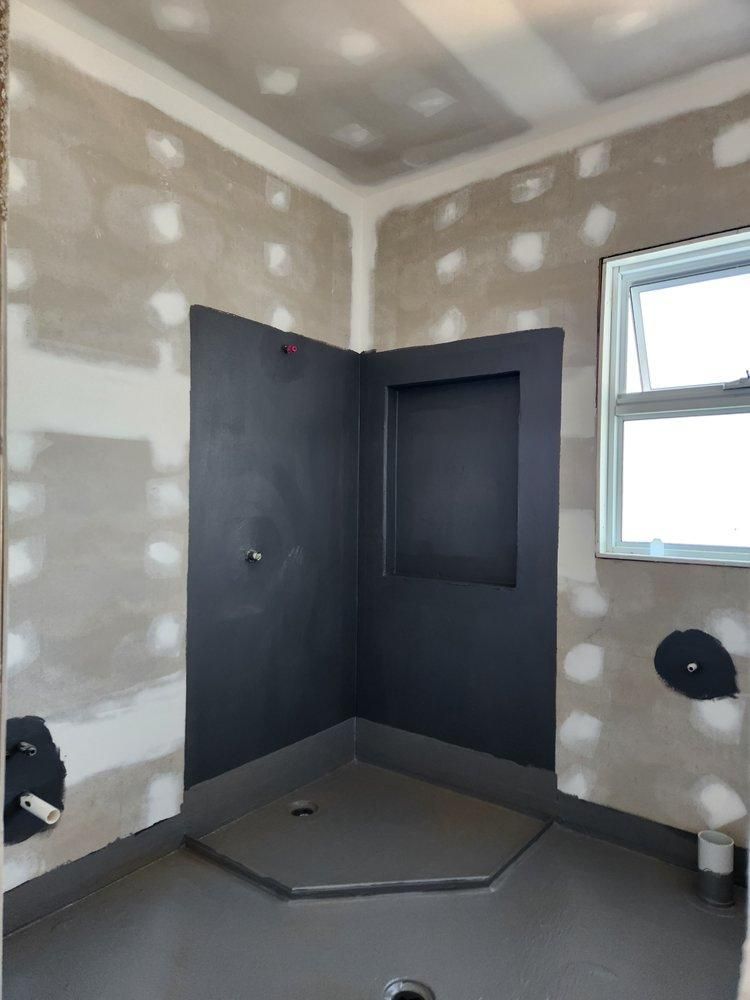 A Bathroom With a Window and a Black Wall — Legend Waterproofing In Nords Wharf, NSW