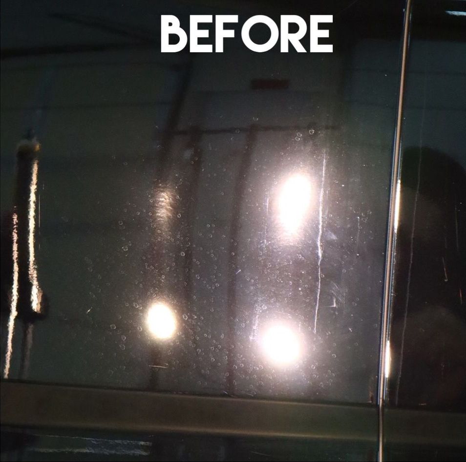 Dirty car window with streaks, marked as 