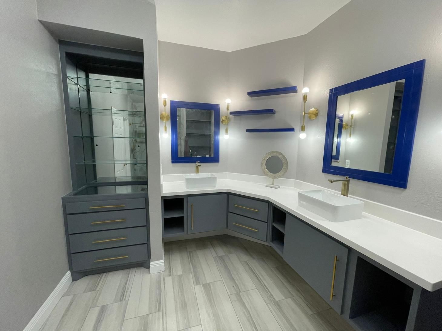 A bathroom with two sinks and two mirrors.