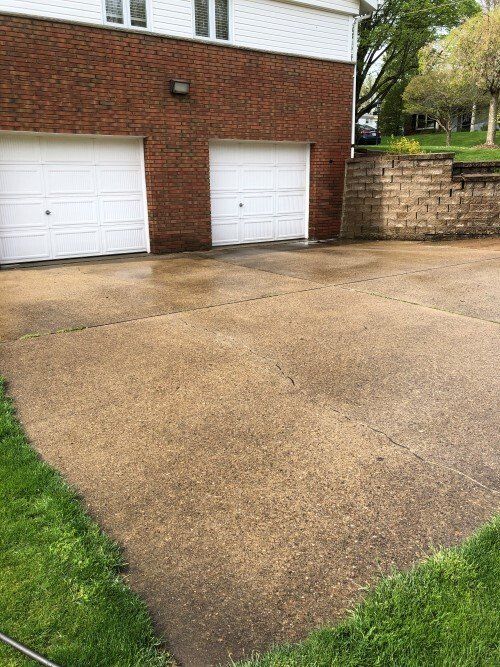 Before Cleaning Of Driveway — Homer City, PA — Awesome Exteriors Pressure Washing LLC Before Cleaning Of Driveway — Homer City, PA — Awesome Exteriors Pressure Washing LLC
