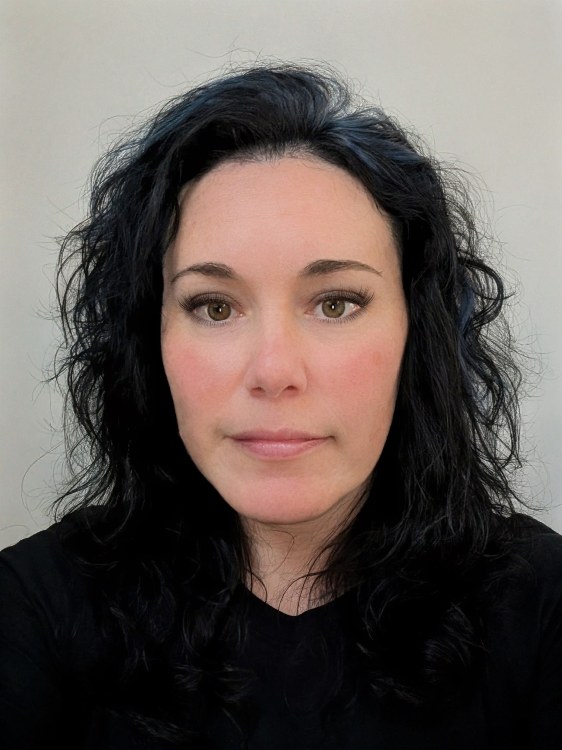A light gray, stylized icon of a human head and shoulders centered on a white background.