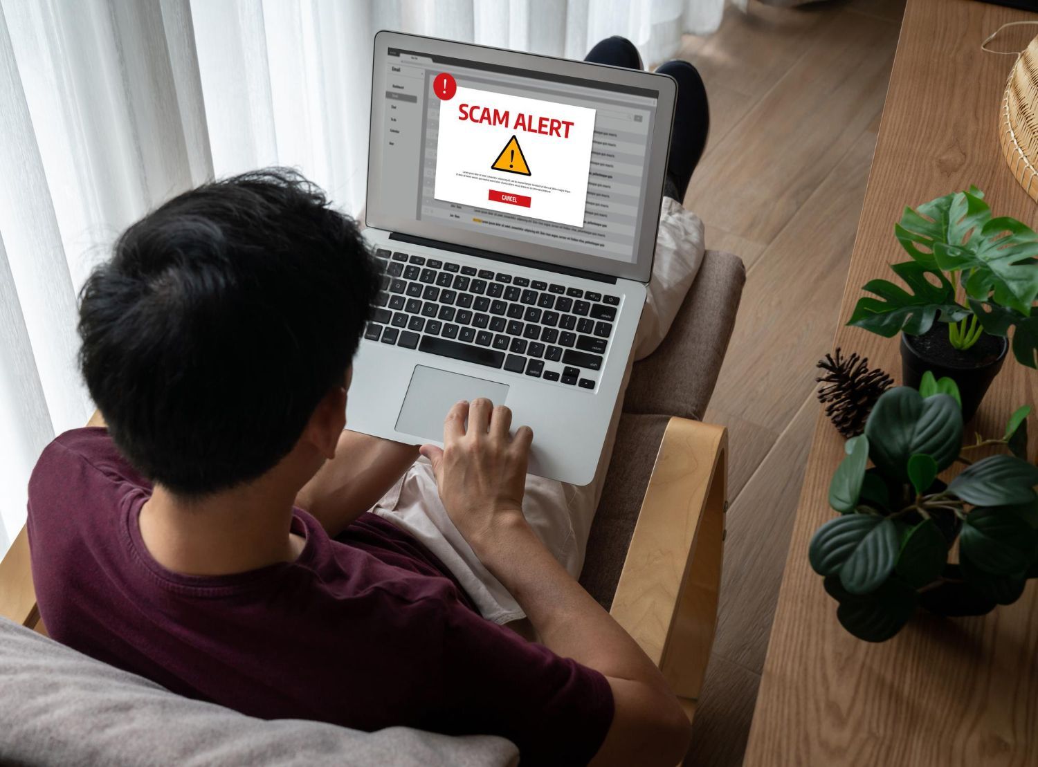 Man using laptop, receiving a
