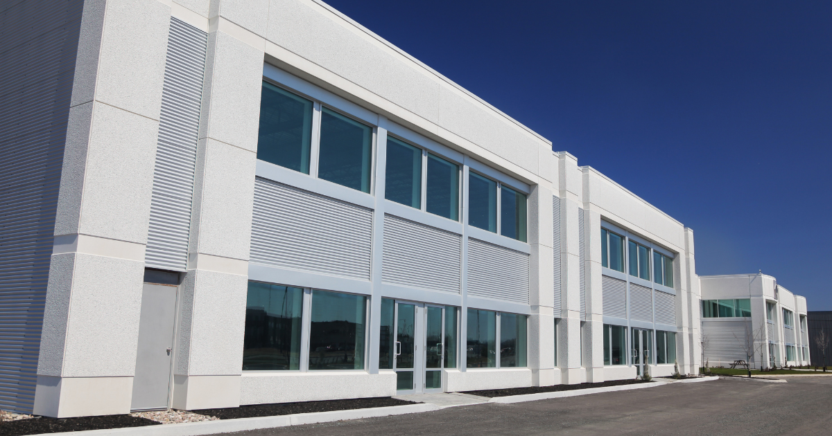 A large white building with lots of windows and doors
