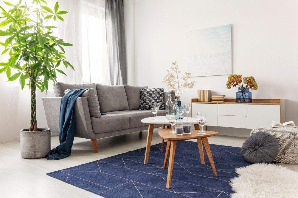 Wooden Table And Grey Couch — Furnishers in Alice Springs, NT