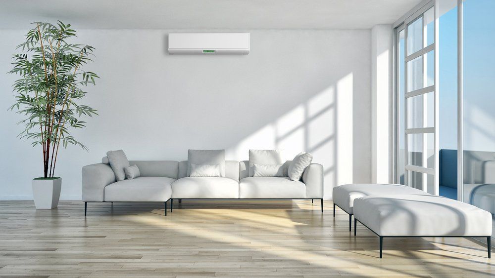 White Sofa Set And Wooden Floor — Furnishers in Alice Springs, NT