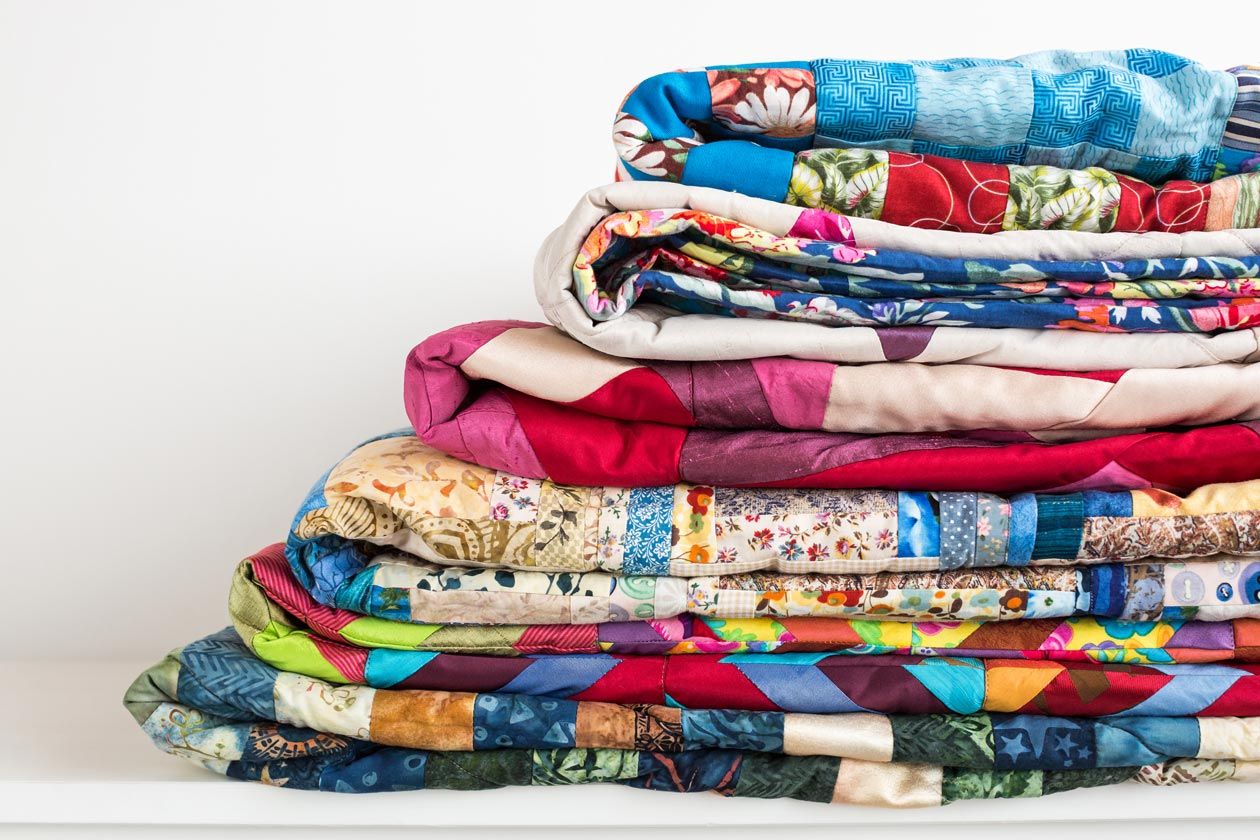 Pile Of Colourful Quilts — Furnishers in Alice Springs, NT