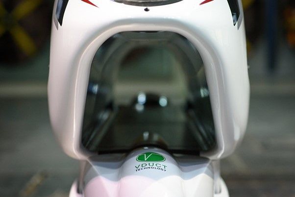 a close-up of a white electric motorbike