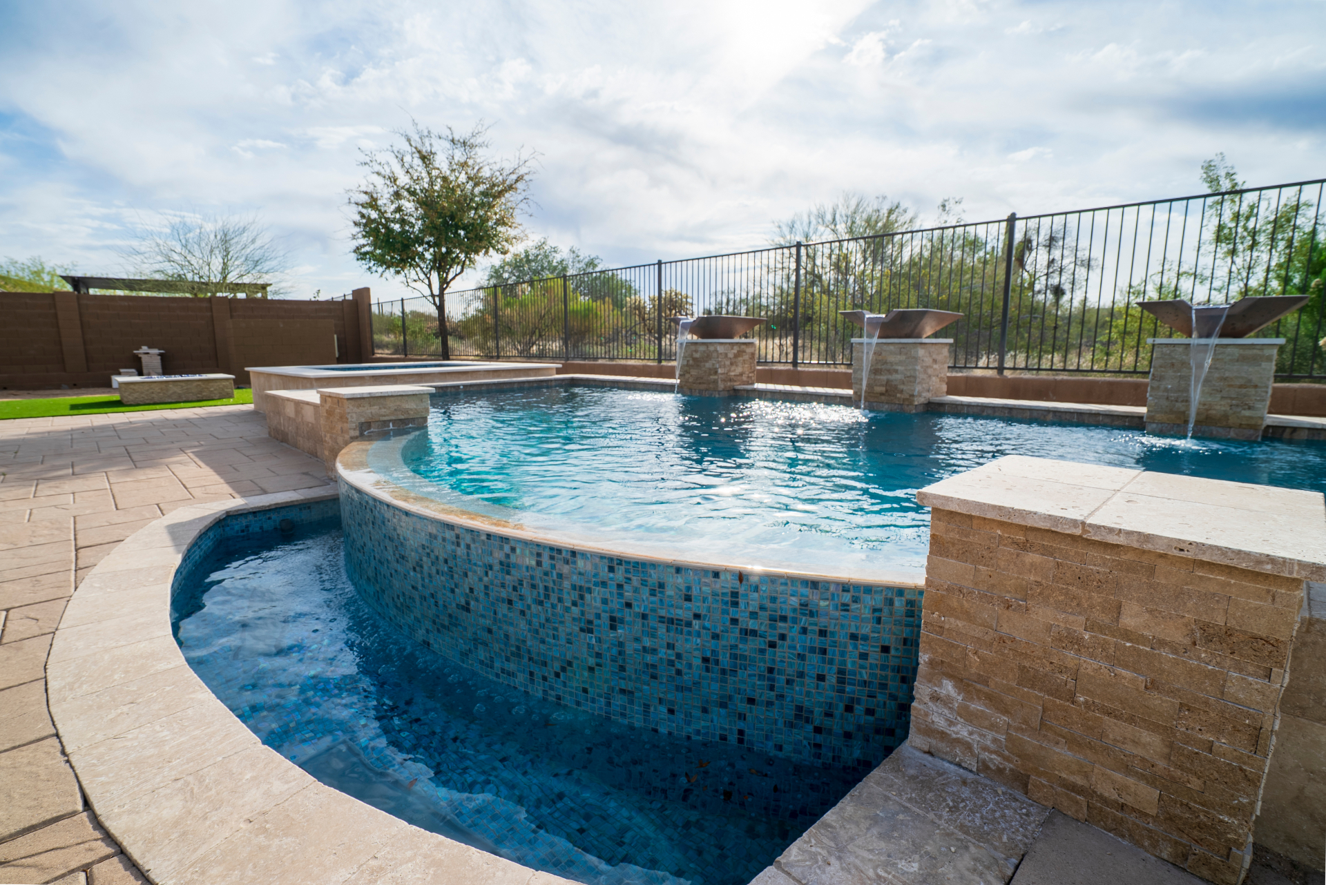 Luxury concrete pool with stone decking — Arizona Pools and Spas Phoenix