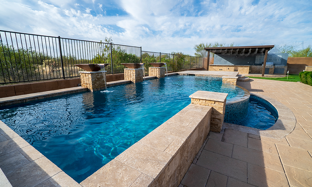 Custom pool build with covered lounge area — pool contractor Phoenix AZ