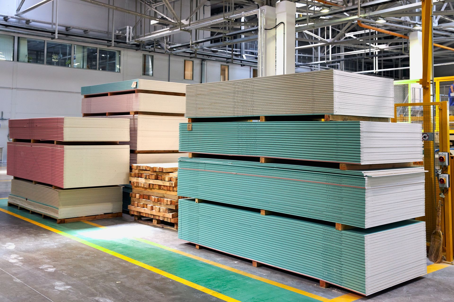 Pallet with plasterboard in the building store.