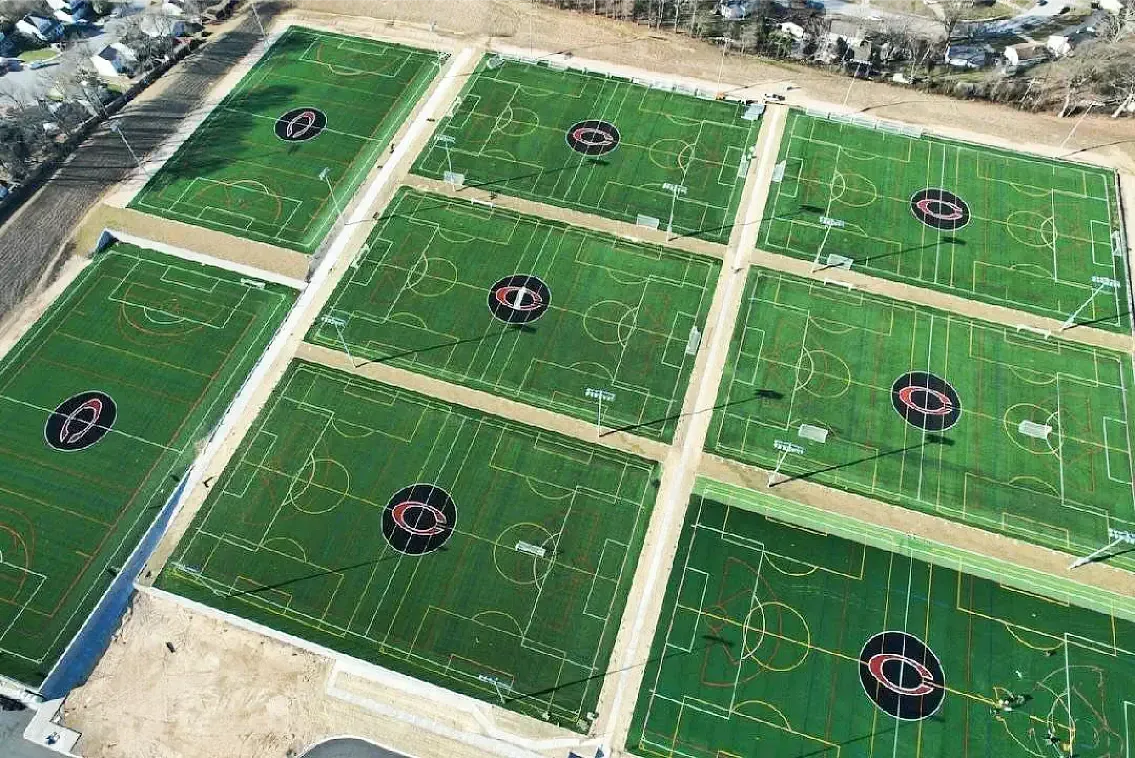 an aerial view of a CopperPlex with 8 turf sports fields.