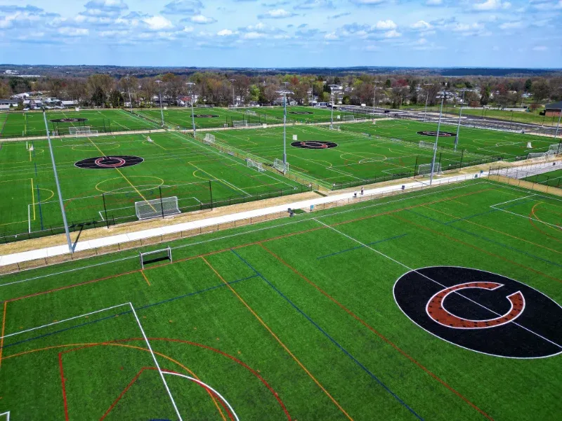 An aerial view of Coppermine Soccer Club's CopperPlex a large soccer field in a residential area.