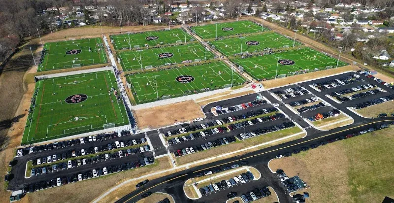 An aerial view of Coppermine Soccer Club's CopperPlex a large soccer field in a residential area.