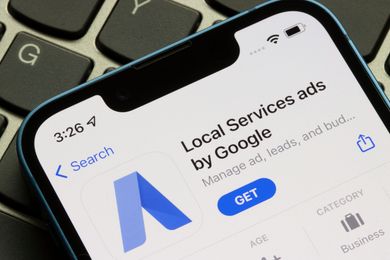 App Store screen showing “Local Services Ads by Google” with blue GET button on an iPhone