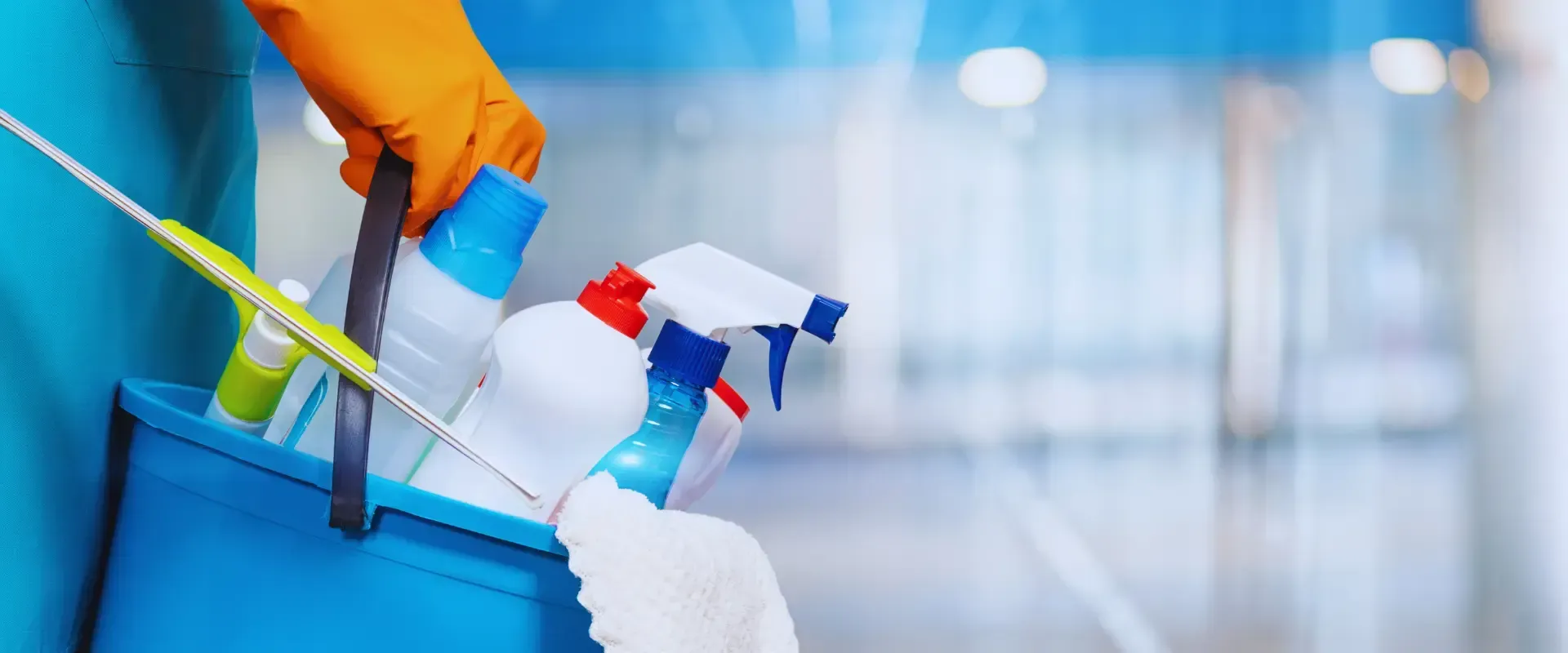 a bucket with cleaning tools