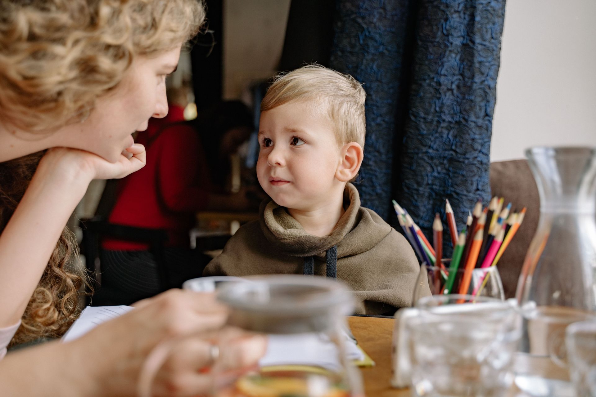 Woman talking to attentive child