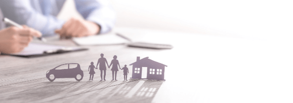 COmox Valley Life Insurance Broker meeting with a client wearing a blue collar dress shirt holding a pen and looking over a insurance policy.
